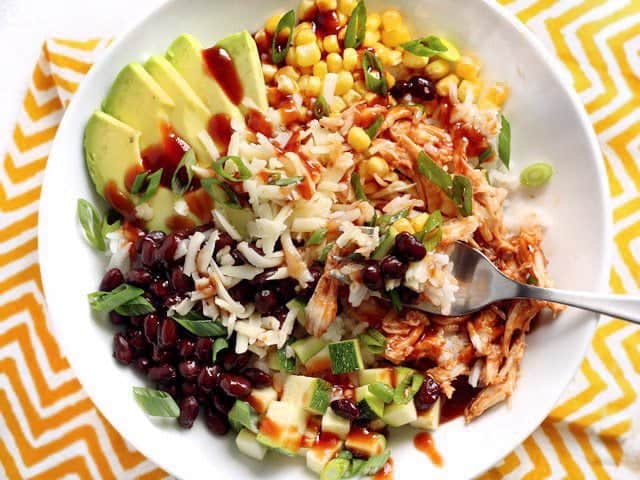 Close up of a BBQ Chicken Burrito Bowl with a fork stuck in the side