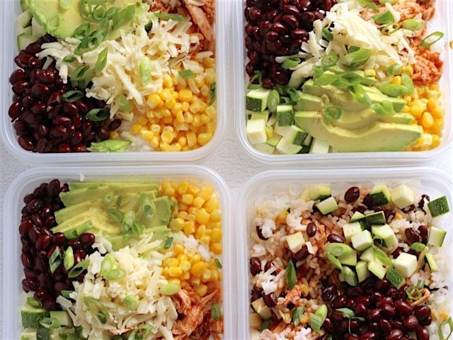 BBQ Chicken Burrito Bowls in four square plastic meal prep containers