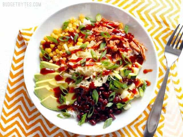 Build BBQ Chicken Burrito Bowls are an easy, customizable lunch option that is great both hot or cold! BudgetBytes.com