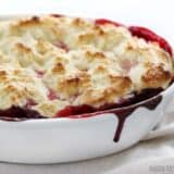 Baked lemon berry cobbler served in a dish.