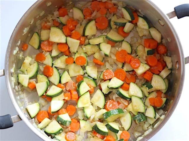 Sauté Zucchini and Carrot in soup pot with onion and garlic