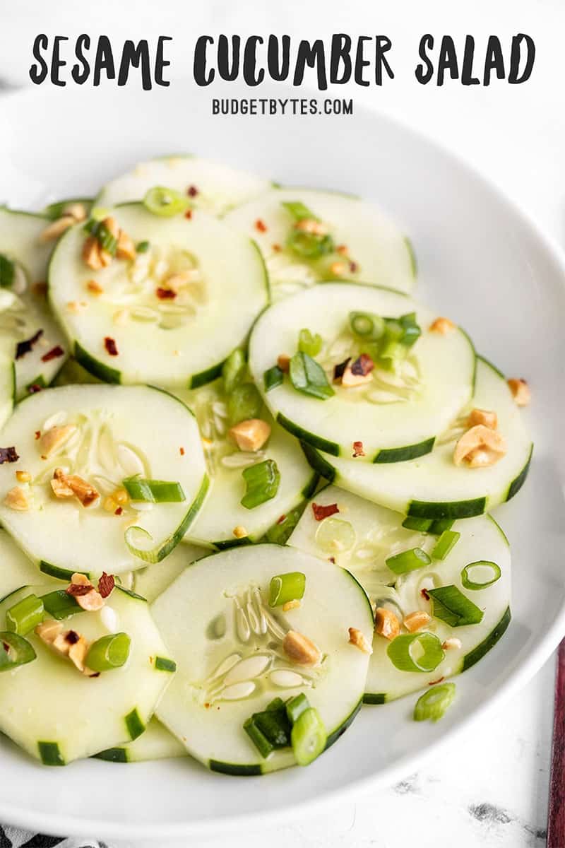 Side view of a bowl of sesame cucumber salad, title text at the top