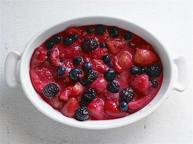 Thawed Berries mixed with cornstarch and sugar, in a casserole dish