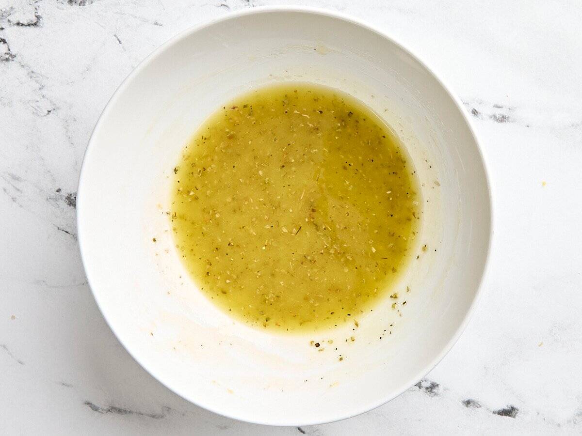 A homemade lemon marinade in a bowl.