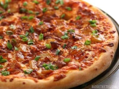 Bacon and Caramelized Pineapple Pizza is everything your sweet and salty dreams are made of. BudgetBytes.com