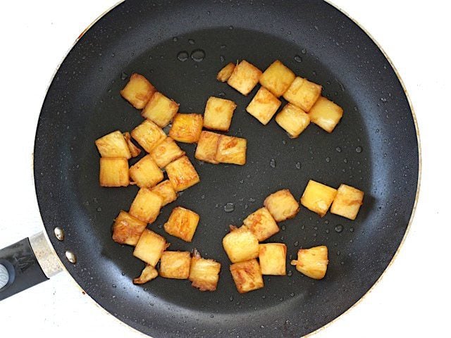 Caramelized Pineapple in the skillet used to cook the bacon