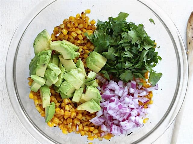 Combine Warm Corn with Vegetables in a bowl