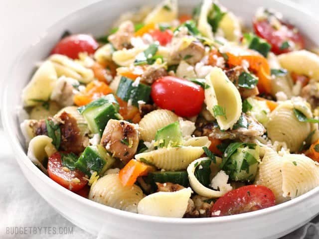 Side view of Greek Chicken Pasta Salad in a bowl