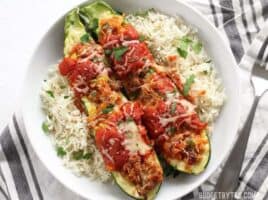 Italian Sausage Stuffed Zucchini is a simple, flavorful, and lighter alternative to lasagna. BudgetBytes.com