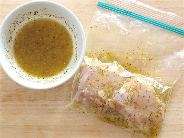 Chicken thighs in a zip top bag with half the dressing