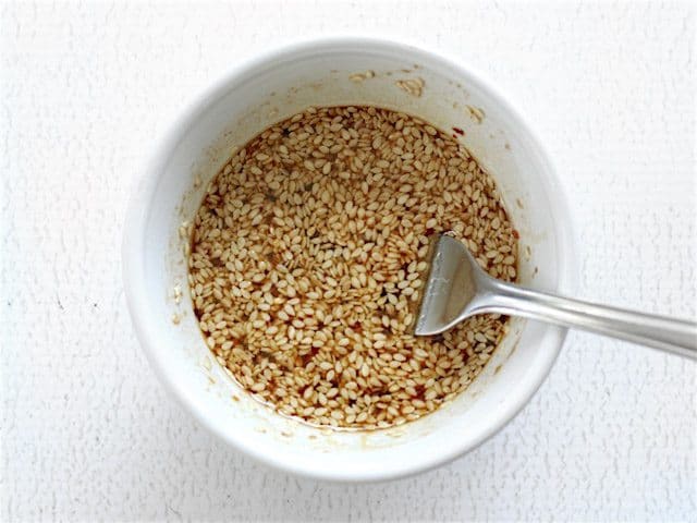 Sesame Dressing in a small white bowl with a fork