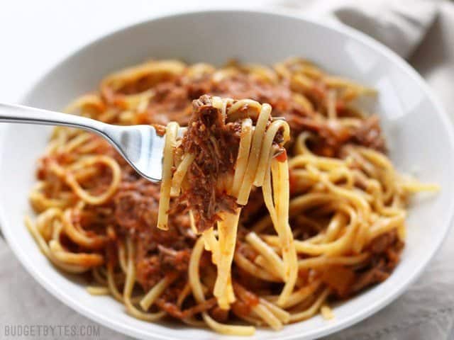 Close up of a forkful of Sunday Slow Cooker Beef Ragù 