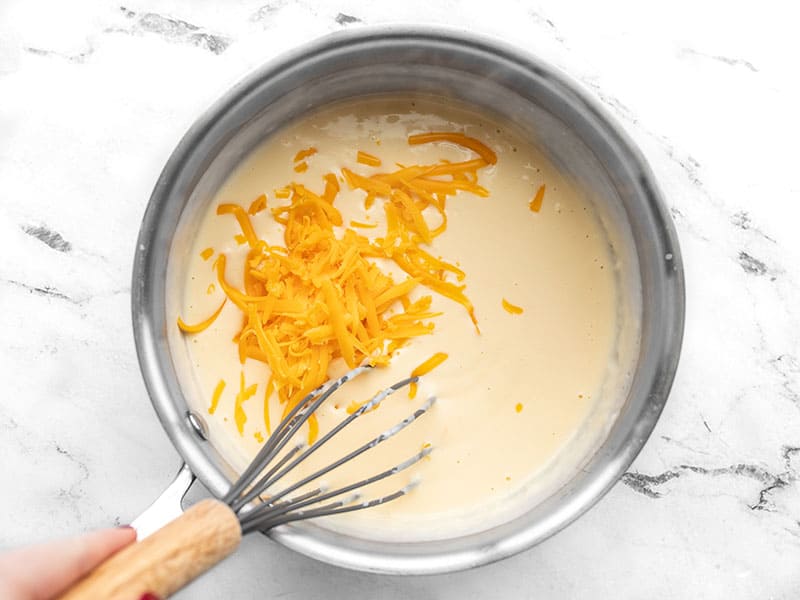Whisk cheddar into white sauce