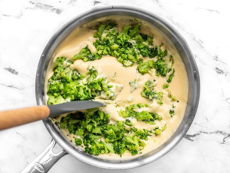 Stir chopped broccoli into cheese sauce