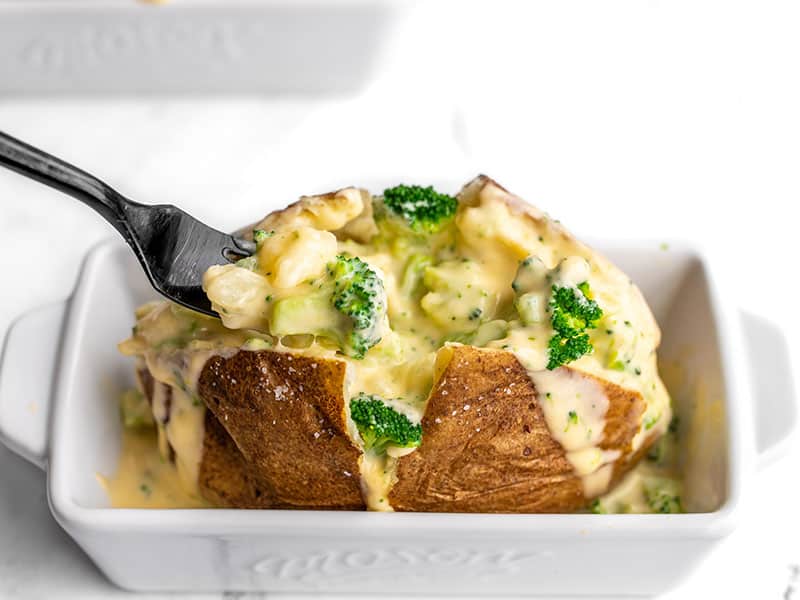 https://www.budgetbytes.com/wp-content/uploads/2016/06/Broccoli-Cheddar-Stuffed-Baked-Potato-eat.jpg