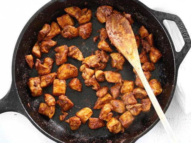 Browned Chicken and Spices in the skillet