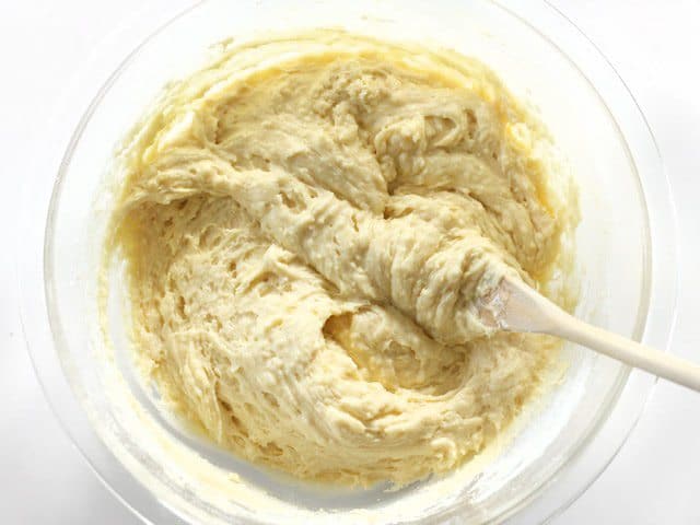 Coffee Cake Batter Mixed in a glass bowl with wooden spoon