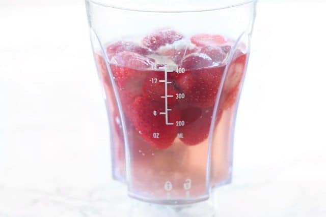 Strawberries and Rosé in the blender, from the side