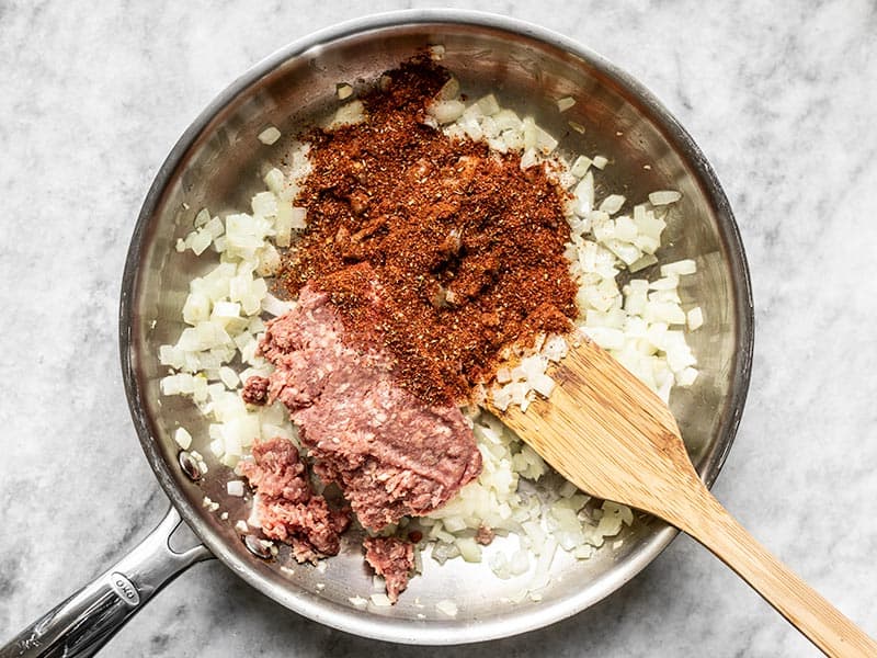 Add beef and taco seasoning to the skillet with onions and garlic