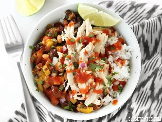Cowboy Caviar combined with shredded chicken and rice to make a bowl meal
