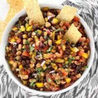 Cowboy Caviar is like a cross between a bean salad and fresh salsa with its colorful mix of beans, vegetables, and a fresh lime infused dressing. BudgetBytes.com