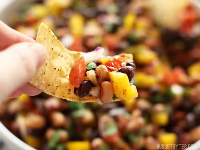Close up view of a chip full of Cowboy Caviar 