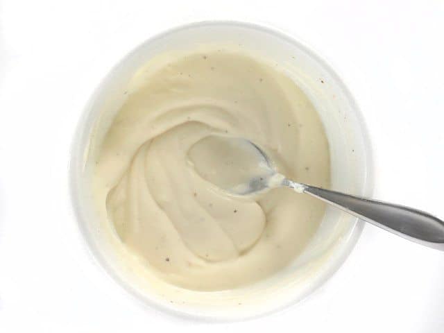 Honey Yogurt Dressing mixed in a bowl with a spoon