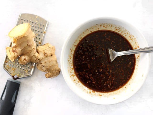 Prepare Simple Ginger Soy Marinade in a small bowl, ginger root and grater on the side