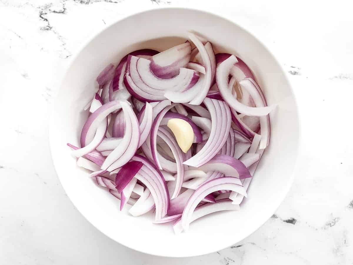 Onions and garlic clove in a bowl