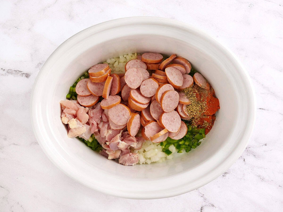 Meat added to the crockpot.