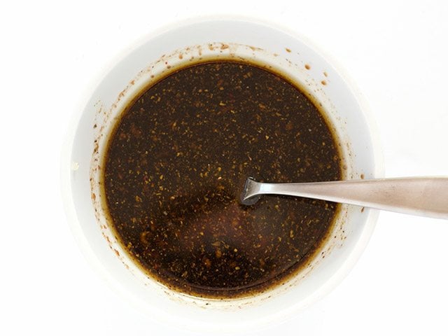 Balsamic Marinade in a small white bowl with a spoon