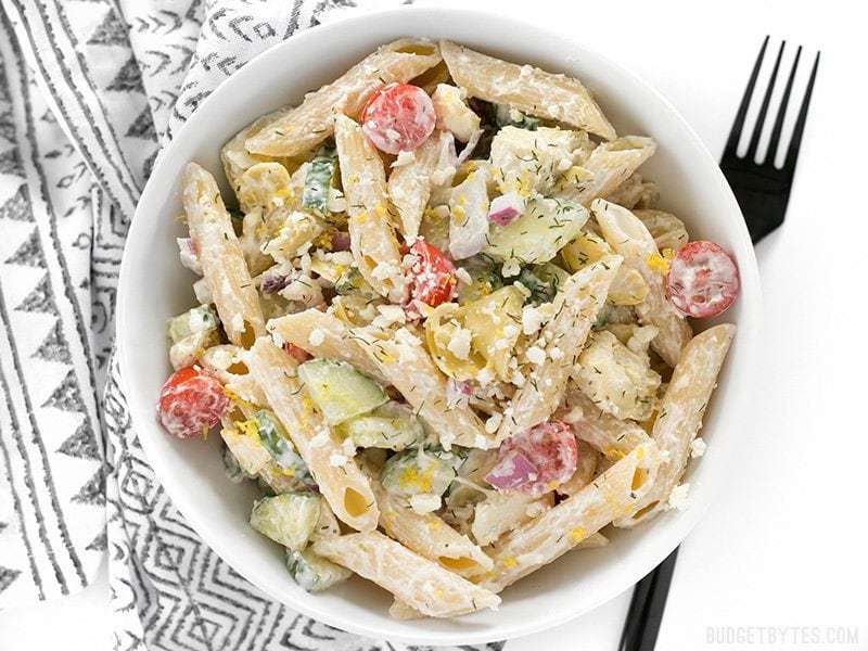 Overhead view of Creamy Lemon Dill Greek Pasta Salad with a black fork on the side