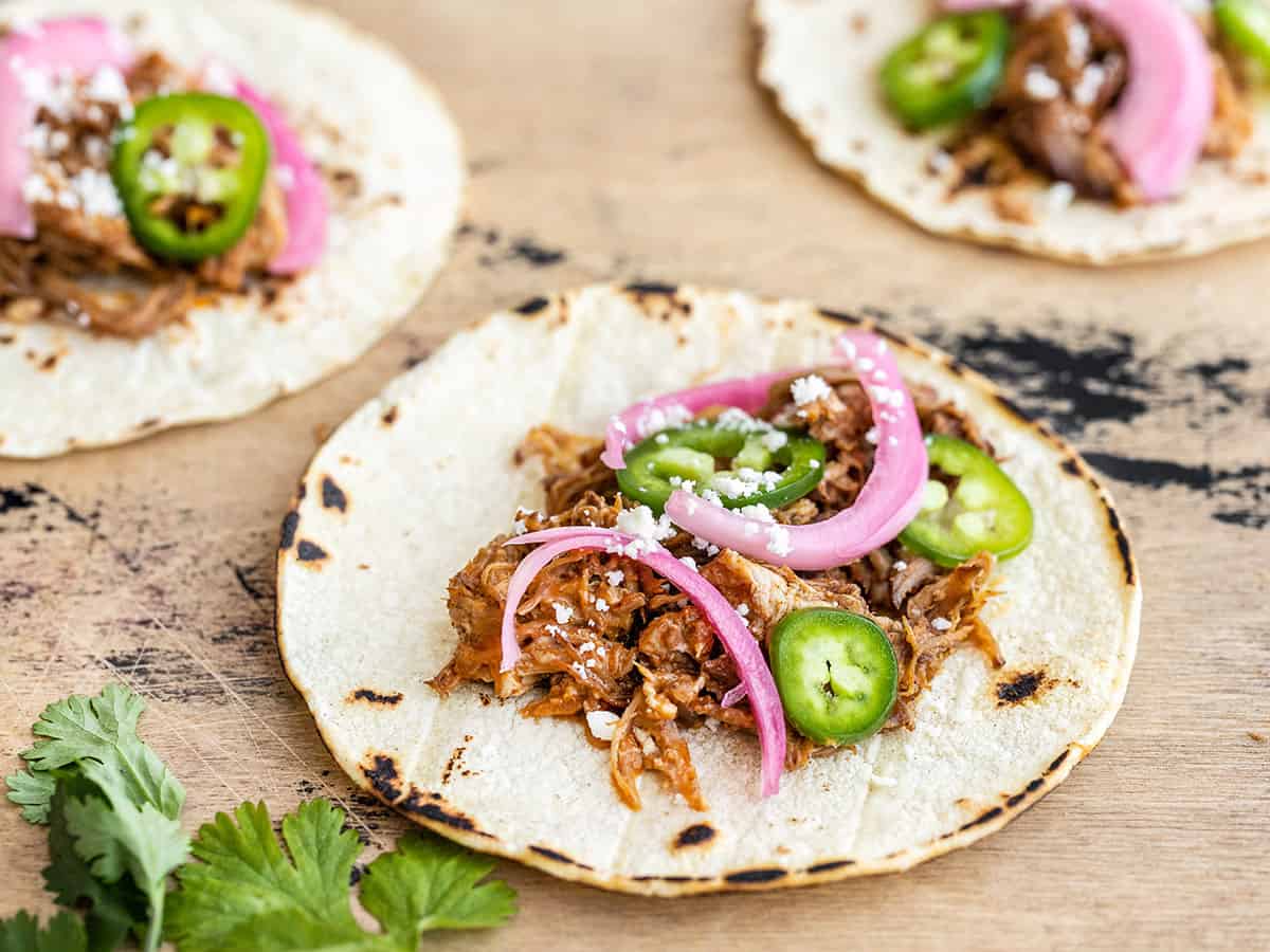 Pork tacos with pickled red onions