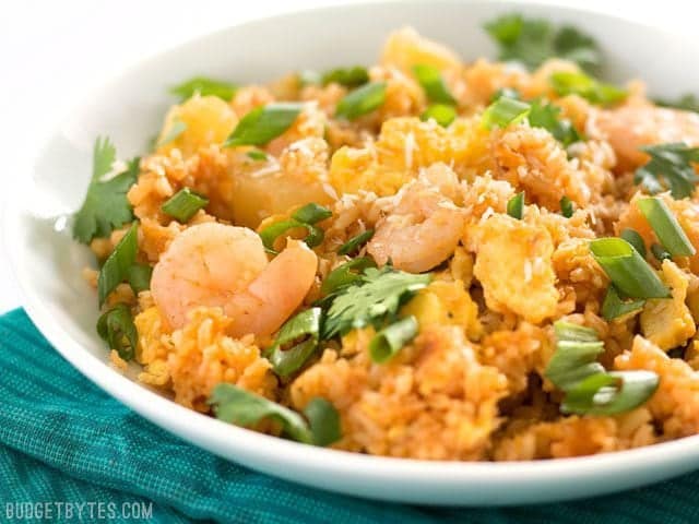 Close up side view of a bowl of Shrimp Fried Rice with Pineapple and Toasted Coconut 