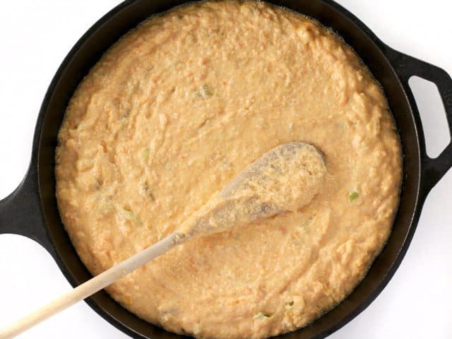 Spreading Batter into Hot cast iron Skillet