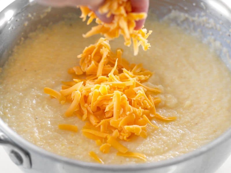 Add Shredded Cheddar to cooked grits in pot