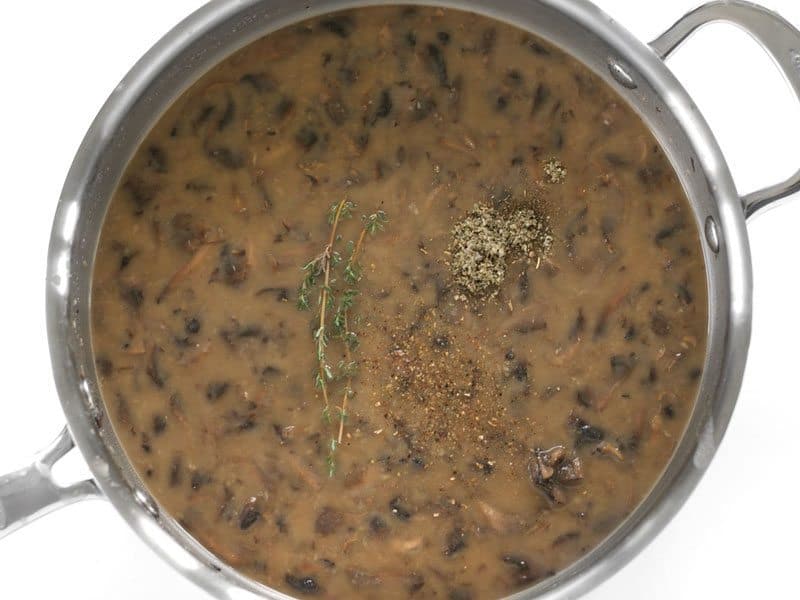 Add Herbs to gravy in the skillet