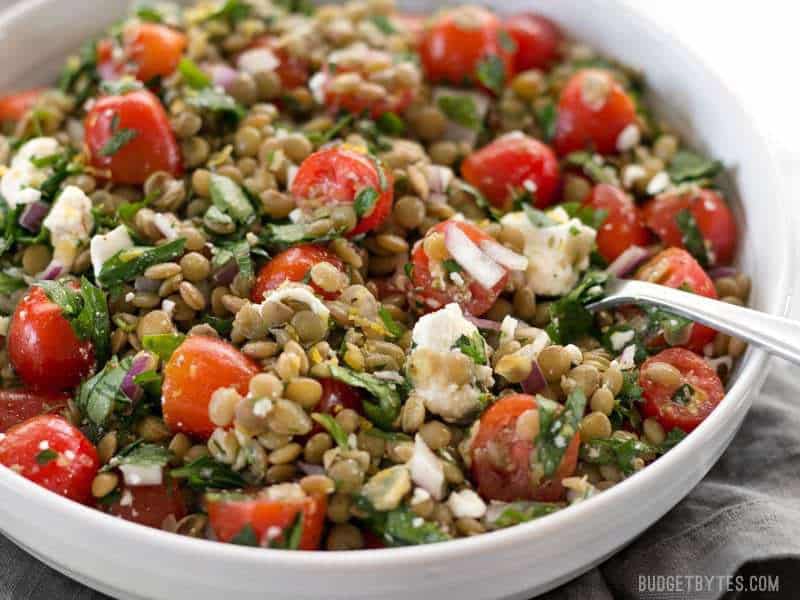 Close up of Marinated Lentil Salad in a bowl, from the side.