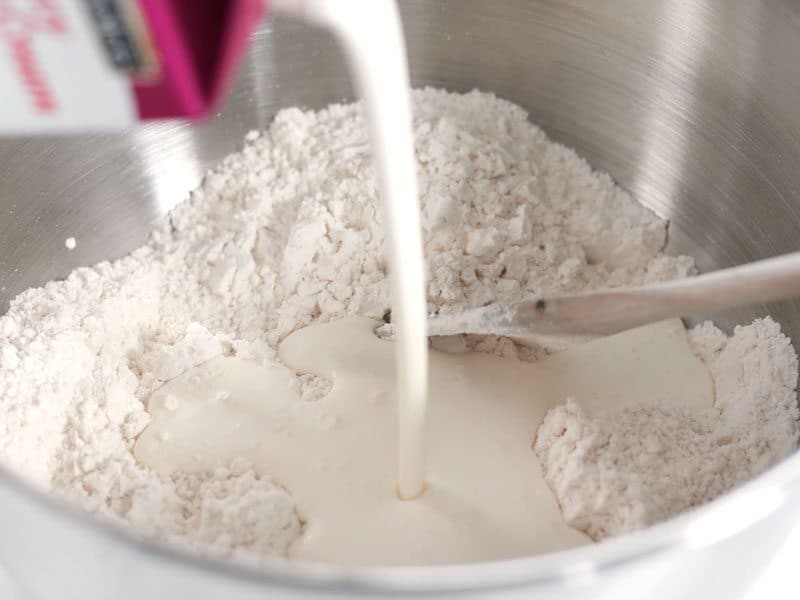Pour heavy cream into bowl of dry ingredients
