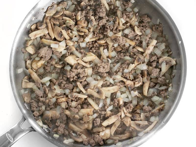 Sauté Onion and Mushrooms in the skillet with ground beef