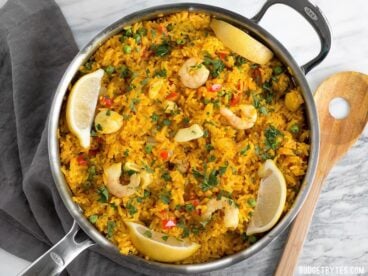 Seafood Rice Skillet is a nod to seafood paella using easy to find ingredients and equipment. Impress your dinner guests with this easy and impressive dish! BudgetBytes.com