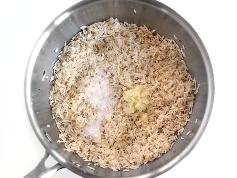 Toasted Rice in the sauce pot with Garlic and Salt