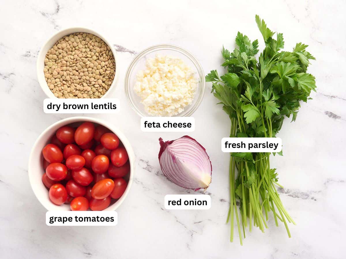 The ingredients to make a lentil salad with labels.