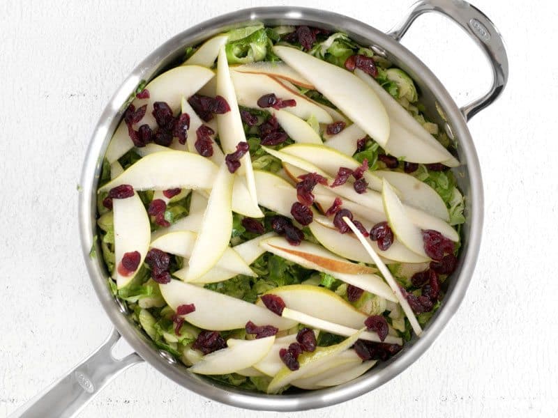 Add Pear and Cranberries to the skillet with Brussels Sprouts