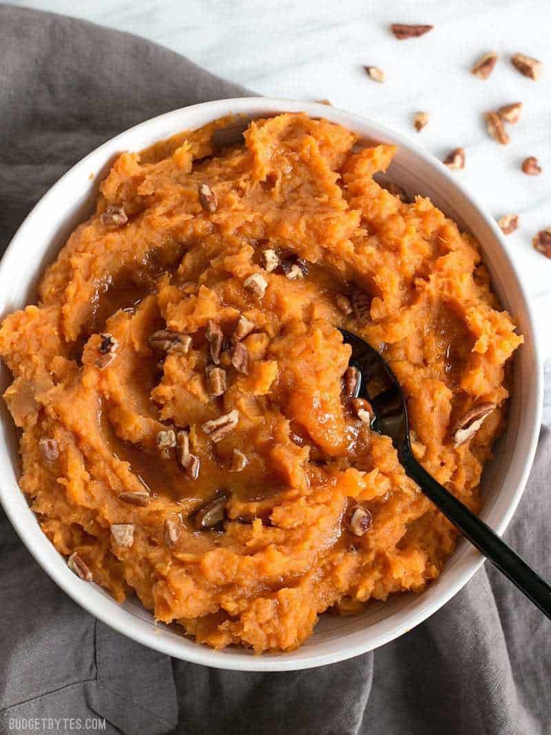 A big bowl of Maple Brown Butter Mashed Sweet Potatoes with crunchy pecans.