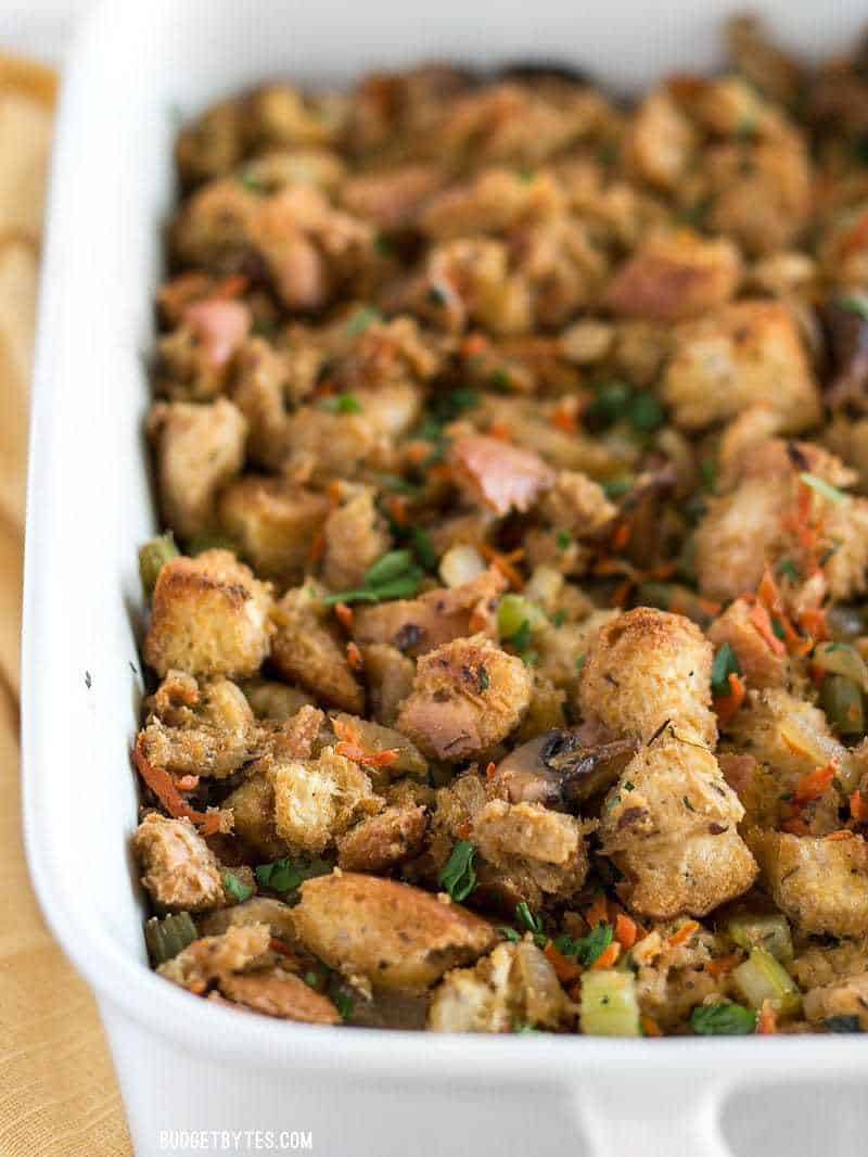 A baking dish full of Savory Vegetable Stuffing viewed from the front