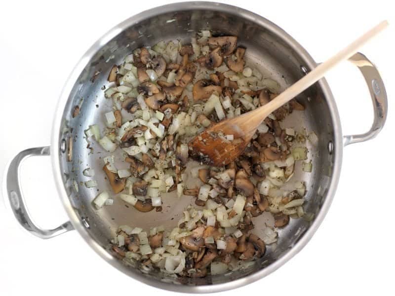 Sweat Onions and Herbs with mushrooms in the pot