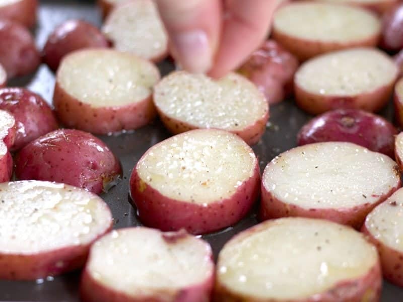 Seasoning potatoes with a pinch of salt 