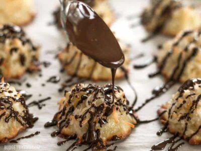 These Chocolate Glazed Macaroons feature a combination of vanilla, almond, and fresh orange zest for an extra fragrant and flavorful cookie. Budgetbytes.com