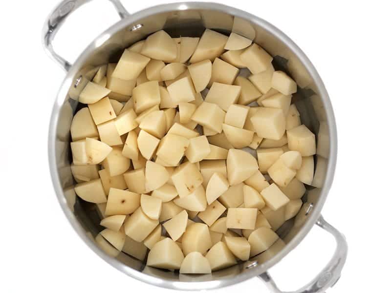 Peeled and diced Potatoes in a stock pot